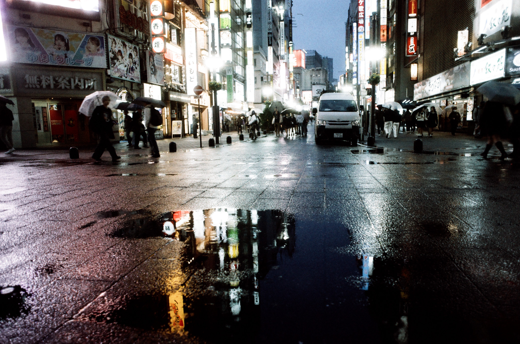 Subway passengers reflected in window